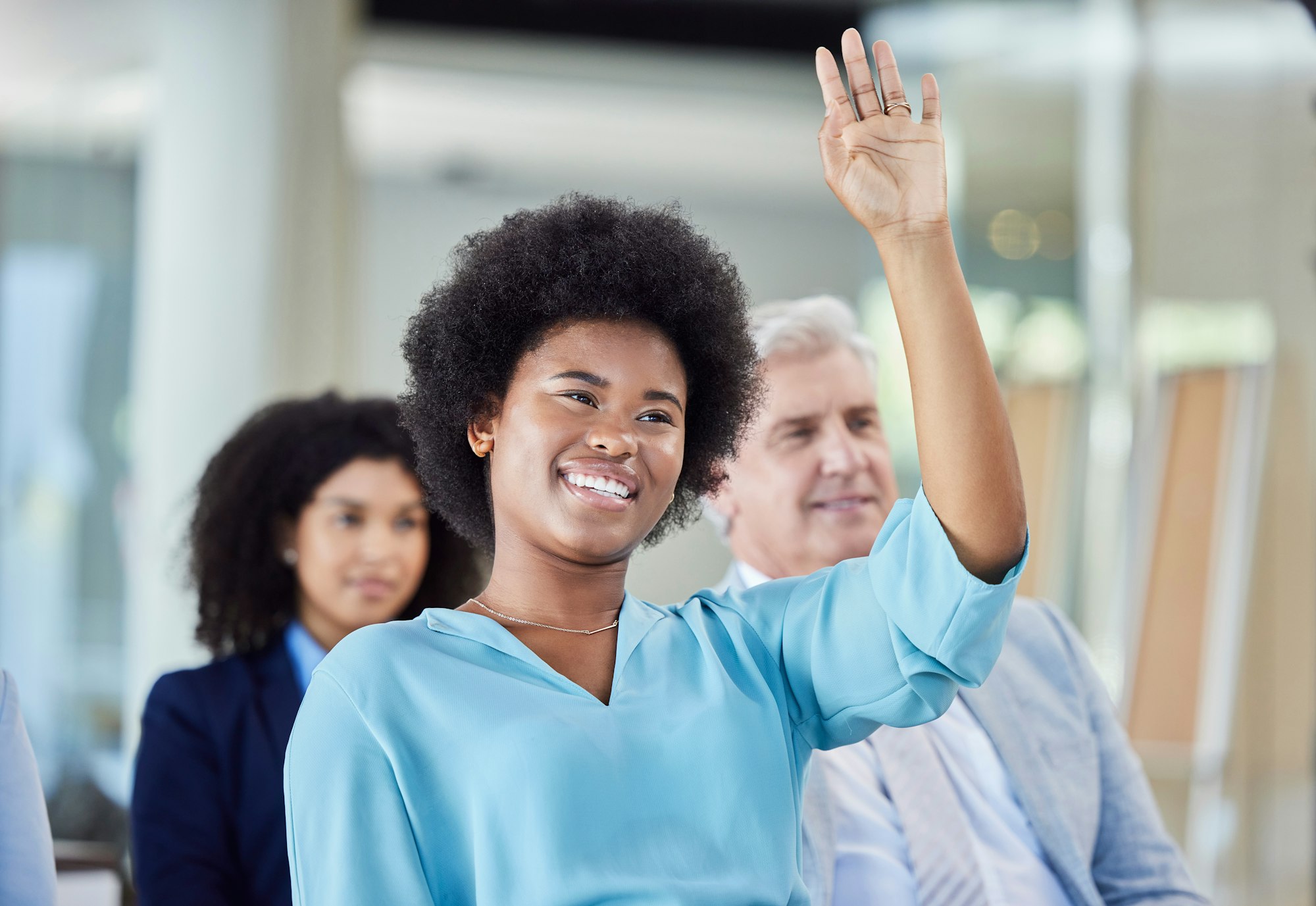 Black woman, presentation and question in business, answer or FAQ in team meeting from audience in